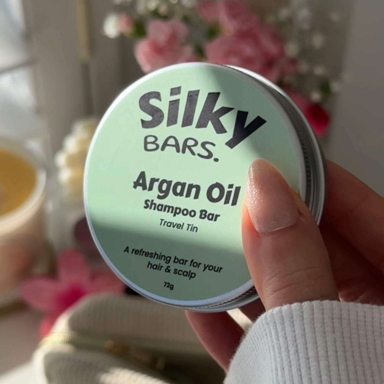 Silky Bars travel shampoo and conditioner bars with their tins