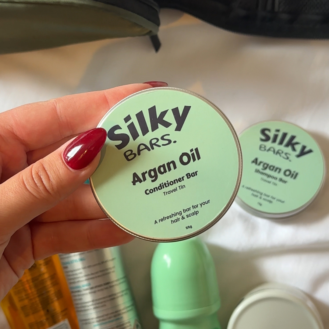 Closed Silky Bars tin packed inside a carry-on bag